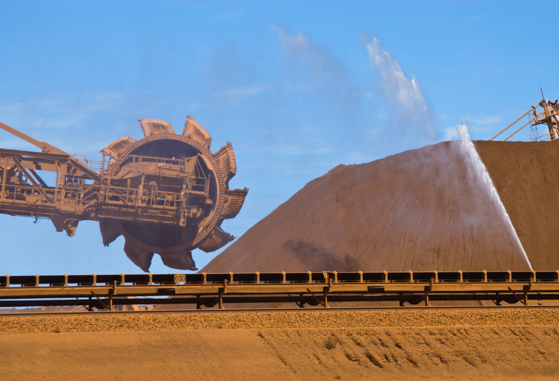 Stockpile of  iron ore at a mining site with Stockpile dust suppression technique being used to control stockpile dust. 