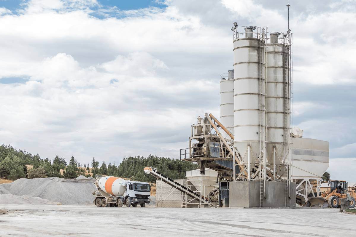 Concrete plant with a concrete dust extraction system for dust control measures. 